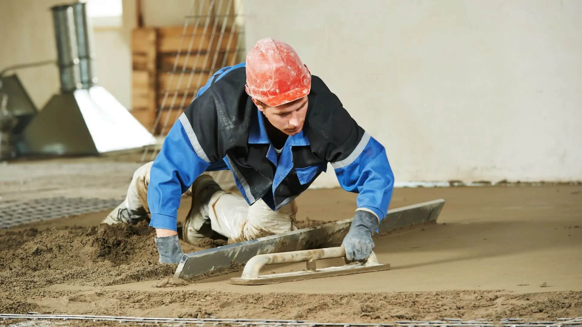 A plasterer working on an indoor cement _Victoria Concrete and Paving